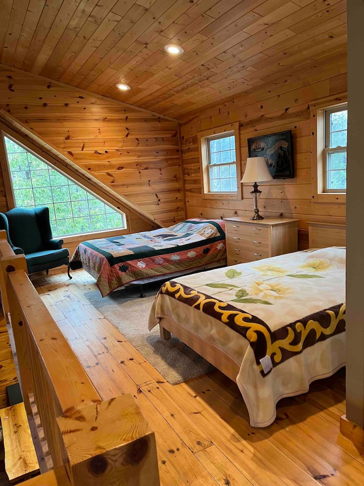 Queen size and full size bed in loft.