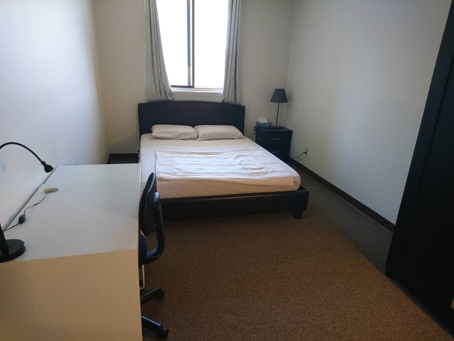 Comfy queen bed in a wide room