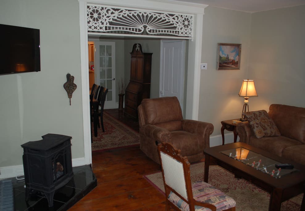 Another angle of living room with realistic gas woodstove
