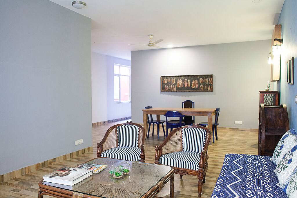 Large living room + dining room with balcony