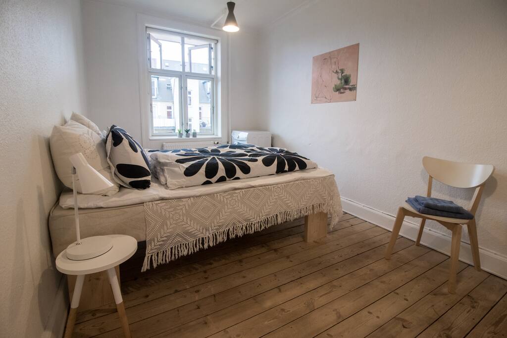 Bright bedroom with window to the courtyard