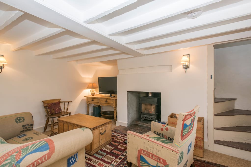 Open plan living room with Norfolk "winder" staircase to upstairs bedroom