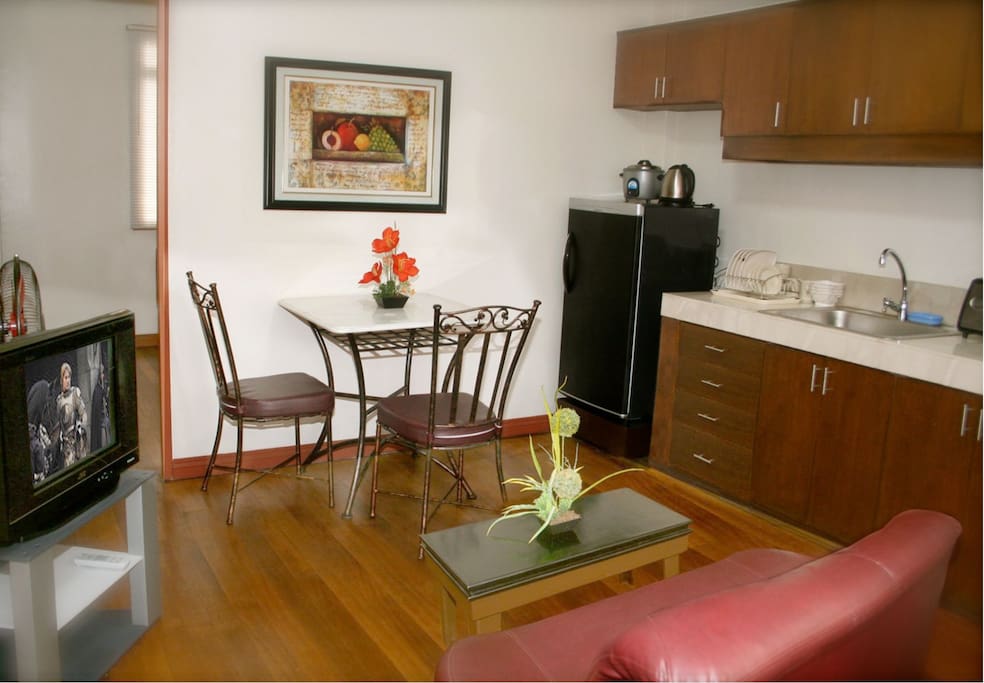 This listing comes with a spacious dining room. Do you plan on cooking dinner for that special someone? We have all the dining-ware, kitchen-ware, etc that you will need! (Note: The Television was replaced with a 32" Flatscreen TV, and moved to the Bedroom)