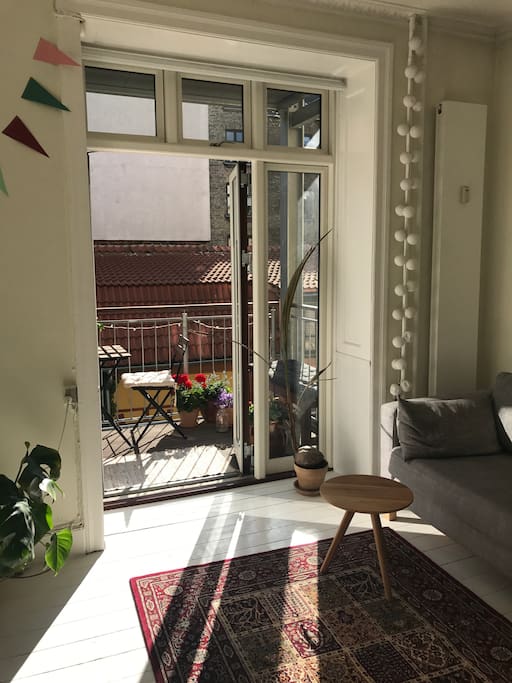 Living room with doors out to the balcony