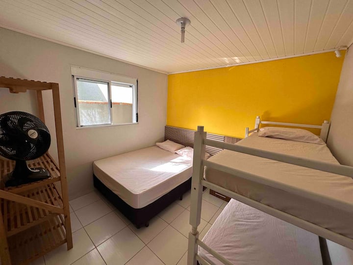 Family room, with a double box bed with springs and a bunk bed, as well as a closet and fan. The windows are with built-in blinds. 
Towels and covers are not available. 