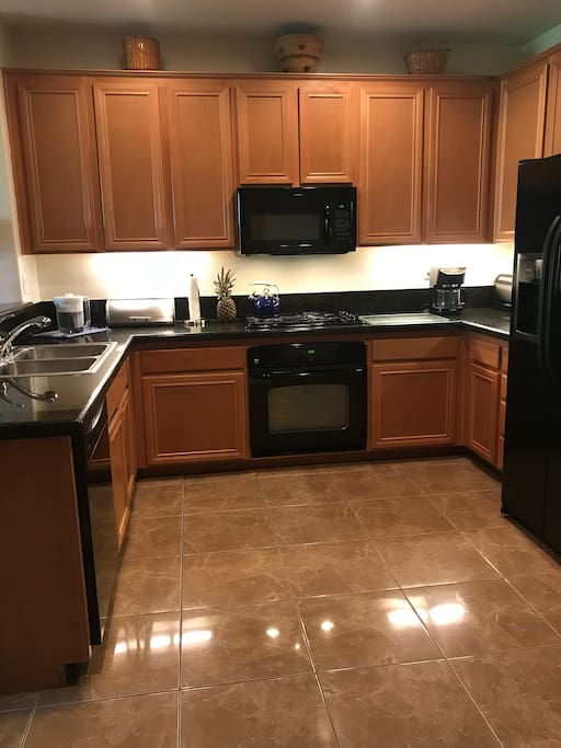 Large kitchen, granite counter tops. Kitchen is fully stocked and ready for your best cooking.