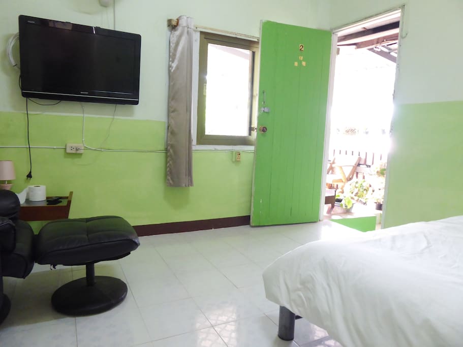 Bright bedroom with TV