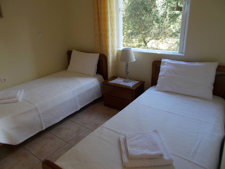 The second room with two single beds.