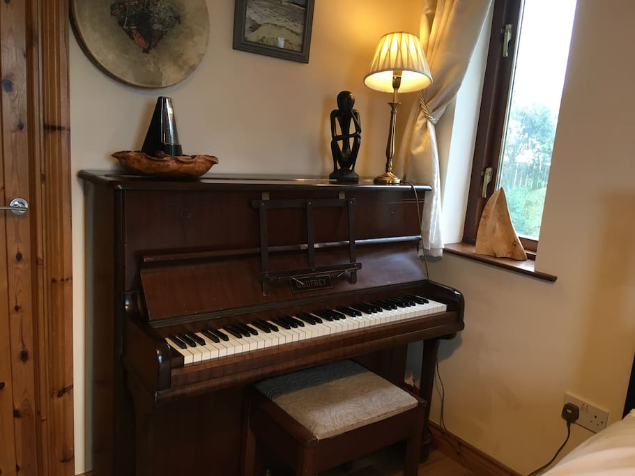 And here's why we call it the Music Room! It's just a small, ship's piano but feel free to play any time..