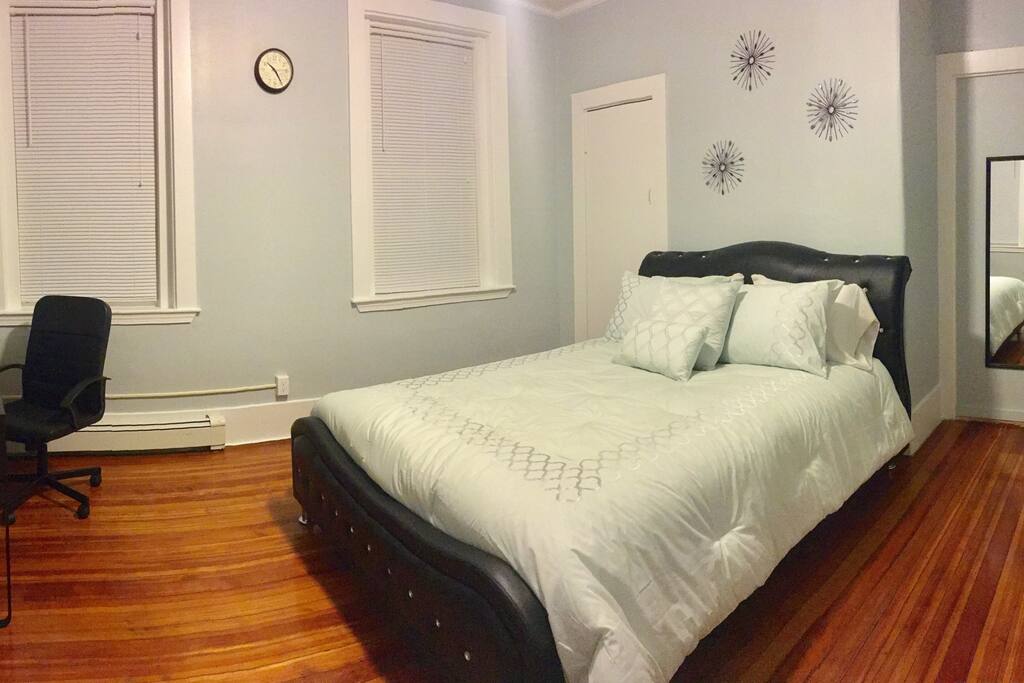 Spacious room with new bed frame, mattress, pillow, comforter, desk, chair, mirror, and hangers available in the closet!