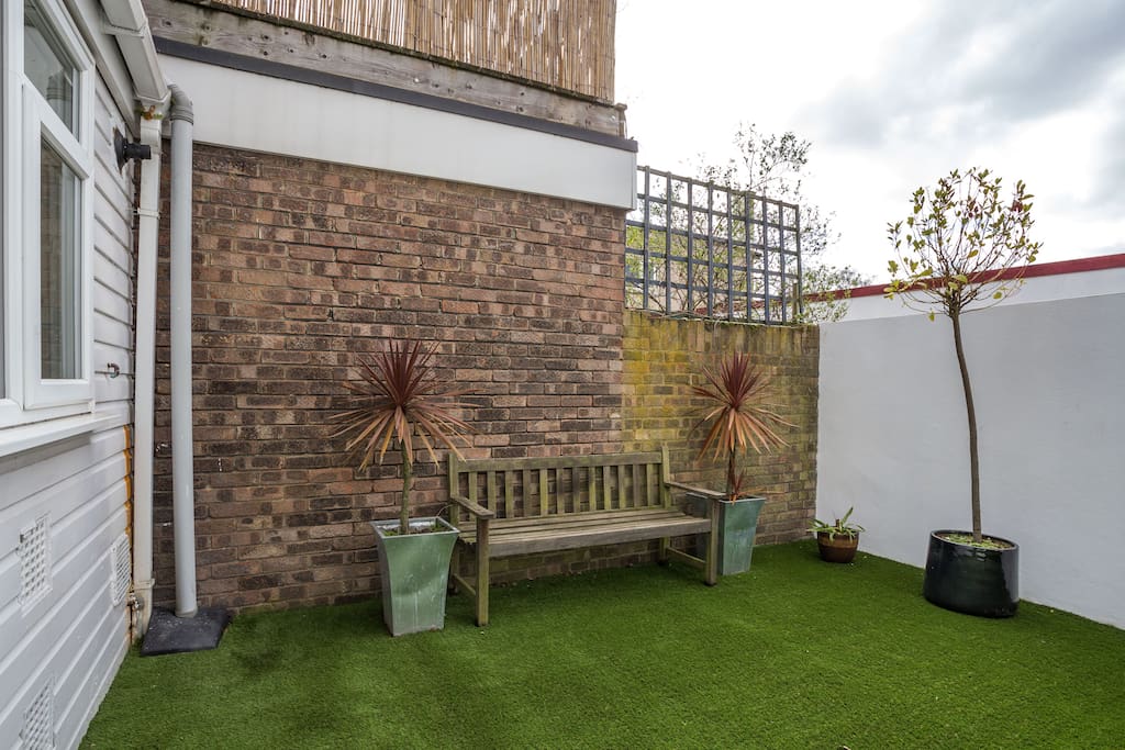 Or enjoy a morning coffee out in the maintenance free garden