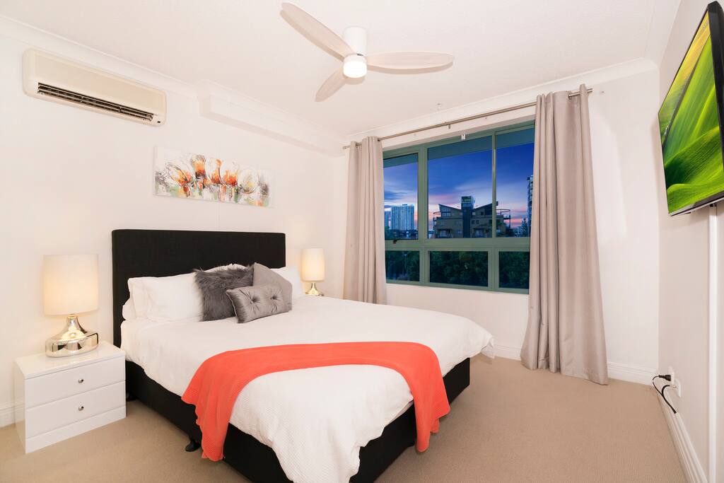 Main bedroom with brand new queen size bed. Built in wardrobe, air-conditioning and ceiling fan.