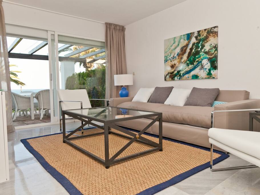 Modern lounge area with access to the terrace and gardens