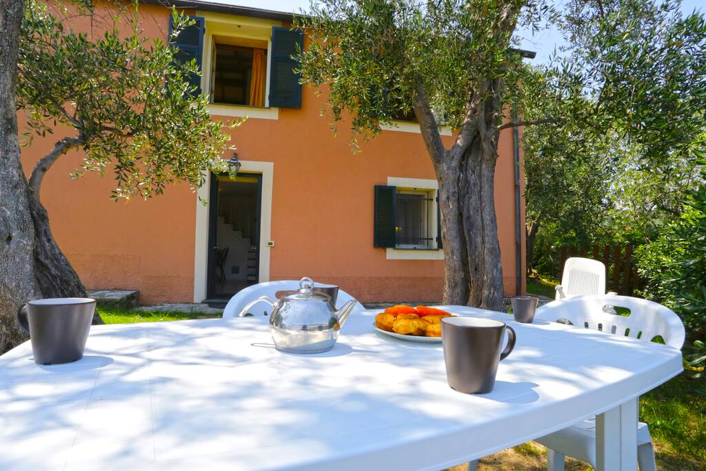 Garden with table for outdoor dining and sea view