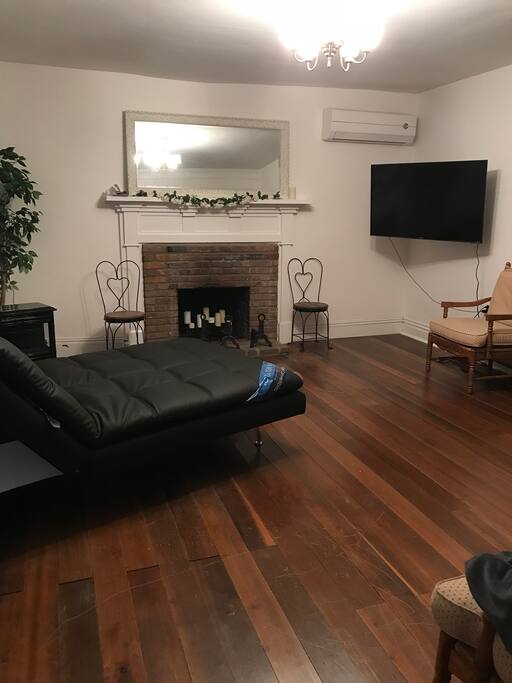 Brand new 55 inch TV with Serta sofa couch in Living Room.