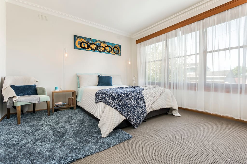 Spacious master, with Queen Bed and cozy linens and wardrobe storage space