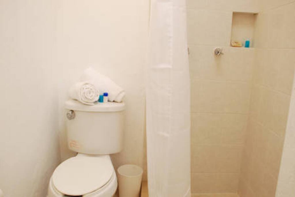 SHARED BATHROOM-
Only two of the rooms shared this full bathroom with shower. Soap, cream, shampoo and clean towels included.