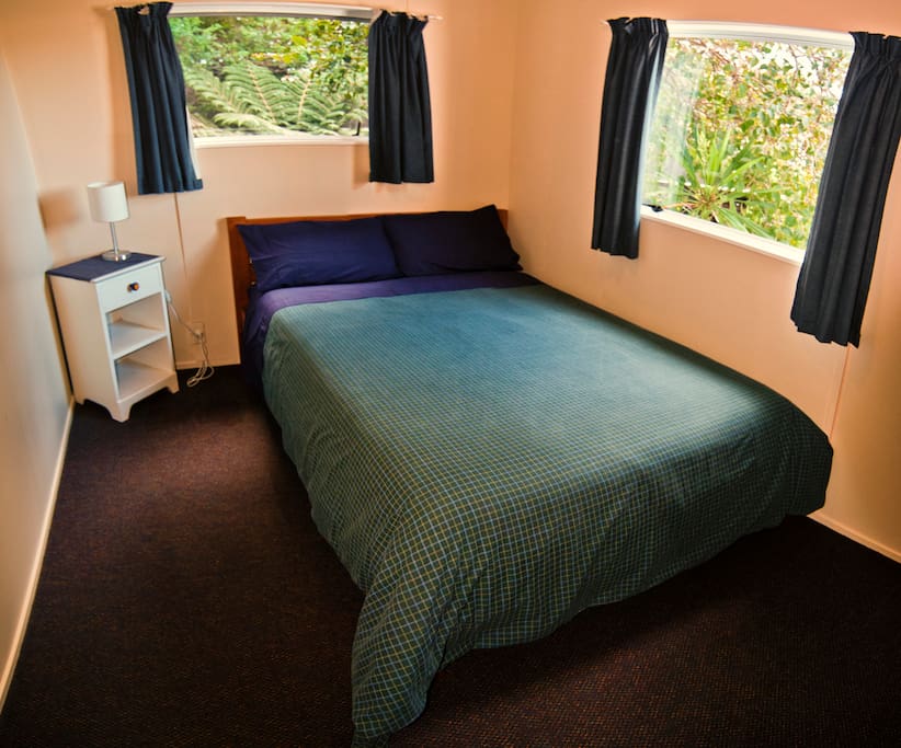 Clean double room with fresh linen and towels.