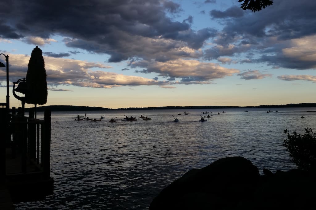 Kayakers wave as they pass by on an evening trip on the lake. And for you who love to kayak and canoe, we can help you find quiet coves and sandy pools and hidden corners of this incredible lake.