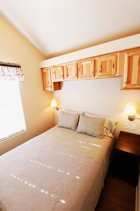 Master bedroom with queen size bed.