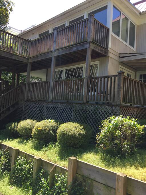 View of back of house (top floor), apartment (lower level).