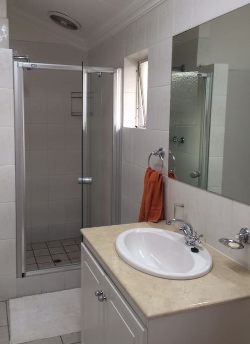 Bathroom is on suite with spacious shower.