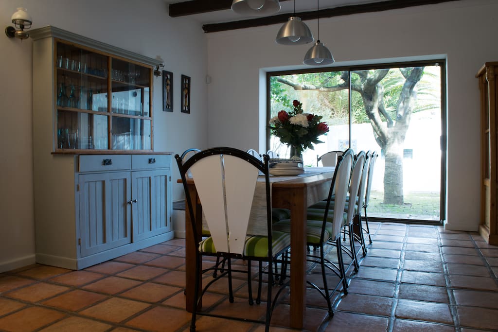 Large dining room leading to back garden and pool