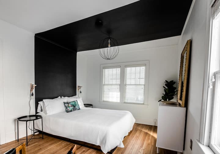 Queen bed with premium bedding.