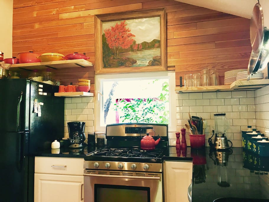 Fully stocked kitchen with Le Creuset and All Clad cookware.