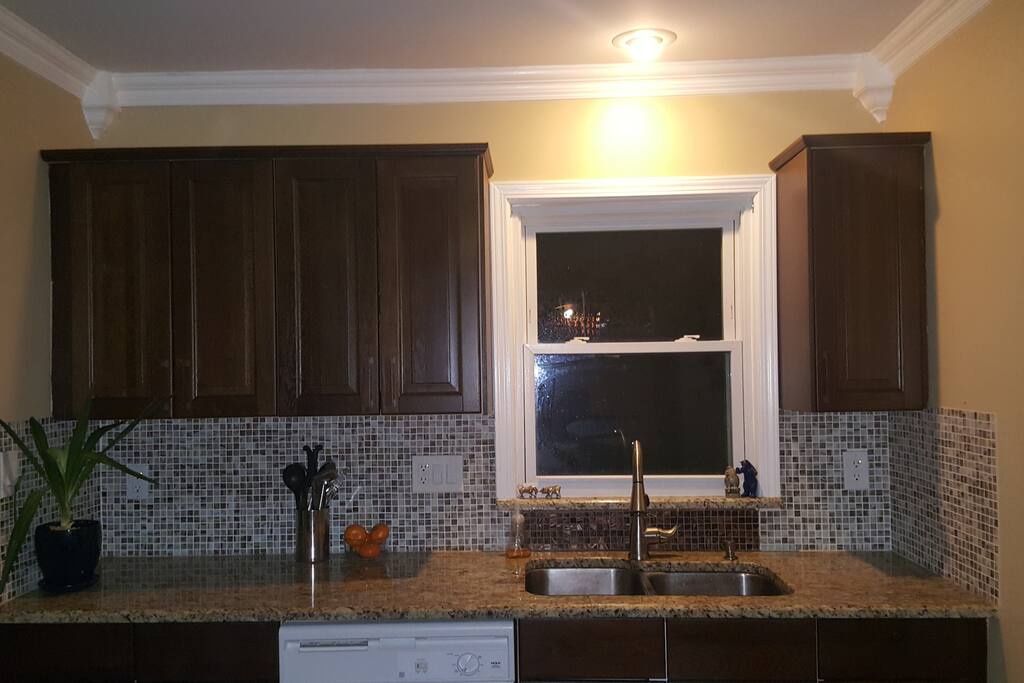 Granite and IKEA Kitchen cabinets.