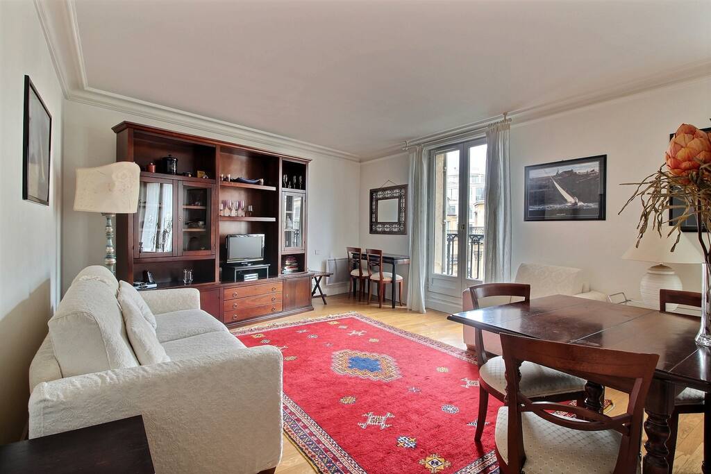 Living room with large double sofa bed and balcony