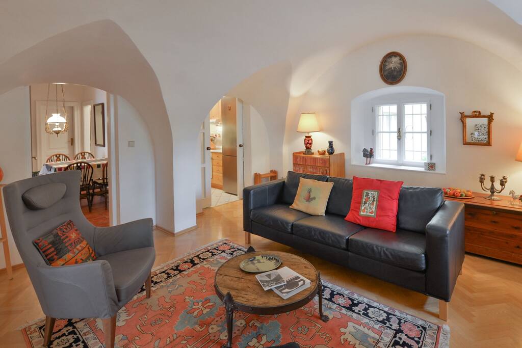 The living room with the dining area and the kitchen in the background