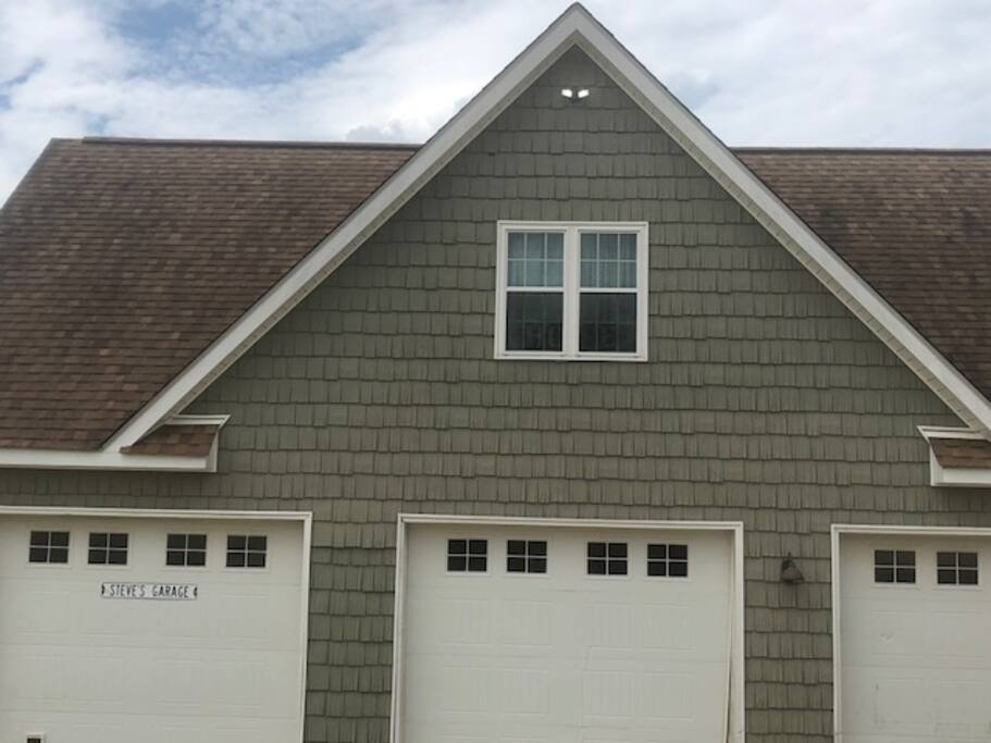 Apartment is located above detached garage.