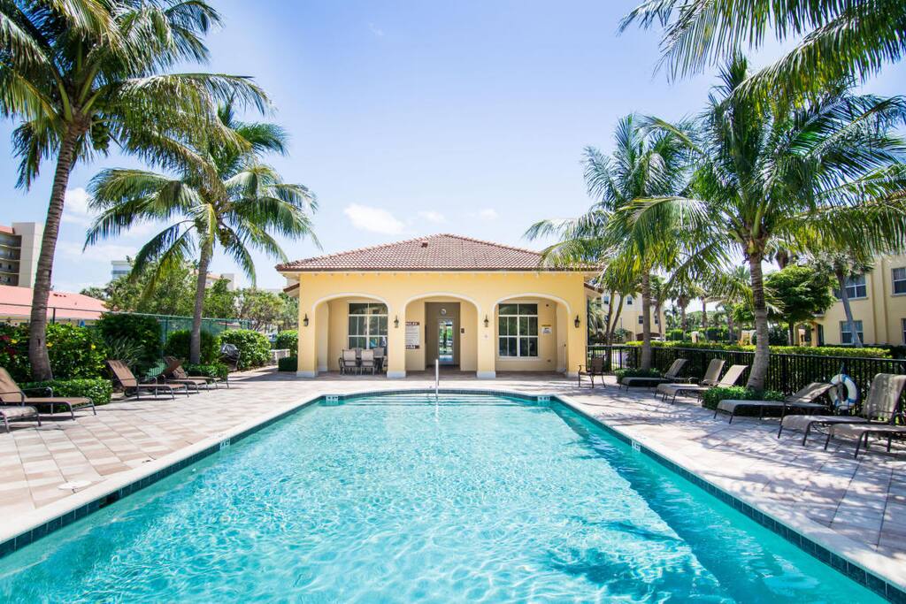 Resort-style community pool steps from residence with Jacuzzi.
