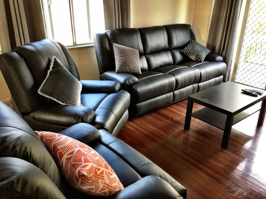Leather lounge suite recliners are great after a long days travel.