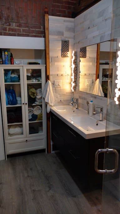 In-suite bathroom with all the amenities, including laundry and steam sauna.