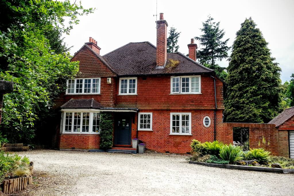 The front of the house with a parking space