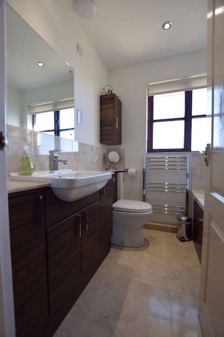 Family bathroom with underfloor heating.