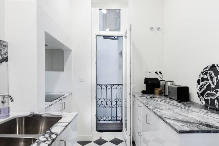 Marble, Molding, and Timber Frames at a Stylish City Retreat gallery image 4