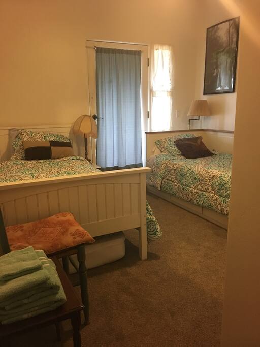 Twin beds and door out to deck