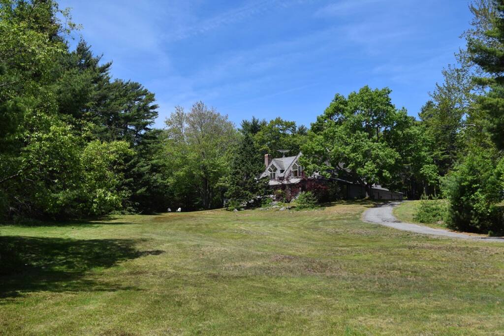 Accessed by private road, its spacious open floor plan invites an elegant yet casual retreat with modern amenities.