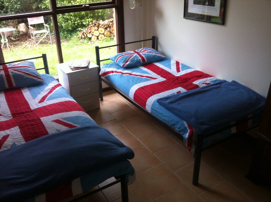 Bright double bedroom looking onto garden