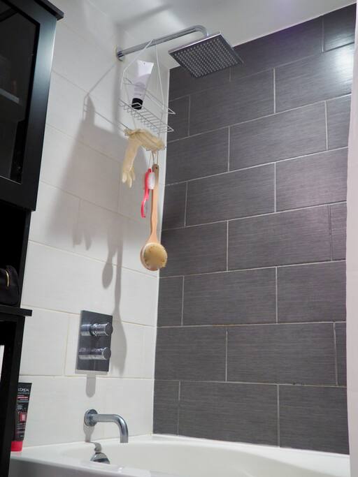 Clean private bathroom with a bathtub