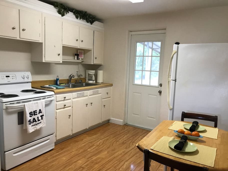 The kitchen featured a breakfast table with 4 chairs, full size stove and over, refrigerator, microwave, coffee pot, and much more.