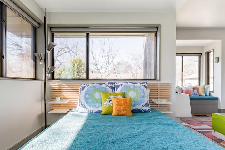 Curl up in the Window Seat at a Colorful Modern Treehouse