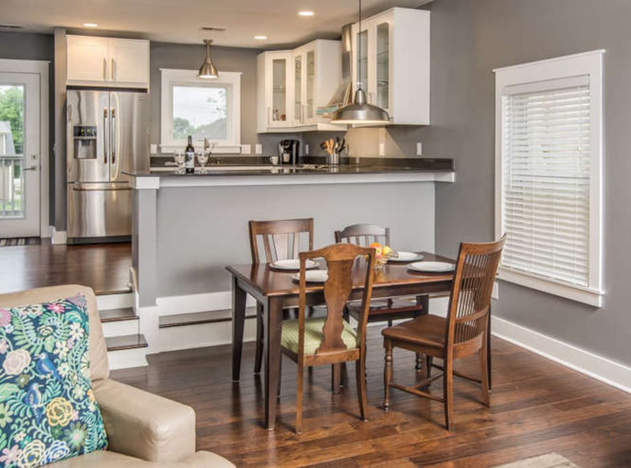 Dining area has room for two additional chairs on ends (provided)