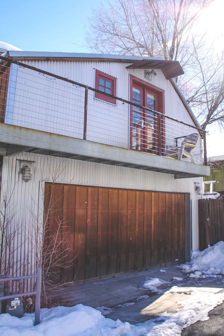 Exterior of our cute studio above a garage in the alleyway!