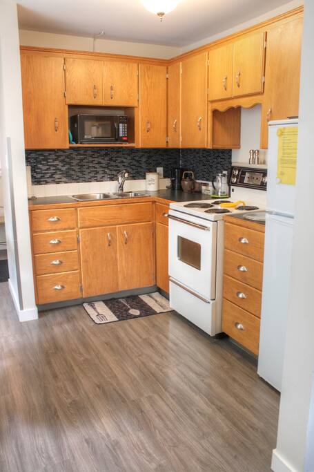 Nicely stocked little kitchen. Coffee, tea, sugar and condiments.
