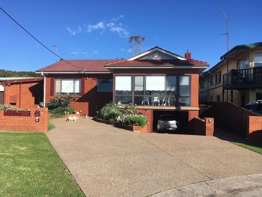 The outside of the house, showing right hand side entrance to backyard flat