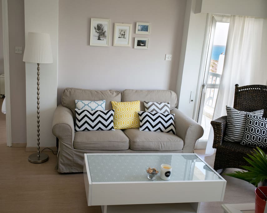 Living room with a cozy sofa and rocking chair